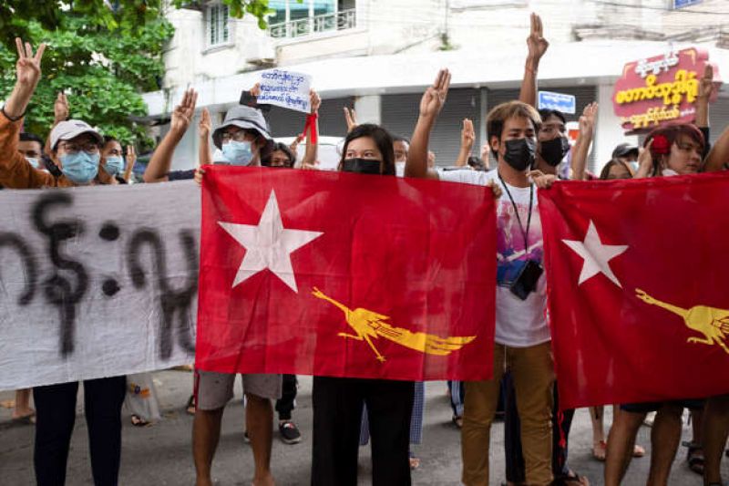 Protesters holding National League for Democracy (NLD) flags raise three-finger salutes during flash protests against the military coup at Bahan township in Yangon, Myanmar, Friday, June 25, 2021-c1a1d9f4e1148555fd0701e41c8979711625291621.jpg